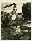 Mardi Gras Clowns reference photo ca 1946 -- Mardi Gras Clowns. ca 1946 L-R: Joseph Rene Martin, Alice Baudean Viosca, Fay Viosca Martin. The picture had been loose in a junk drawer for years and was badly mangled. Bob used the photo as a reference for his Mardi Gras Clowns painting, note the blue paint. His painting based on the photo can be found here: https://www.artbyviosca.com/piwigo/picture/554-mardi_gras_clowns/category/LouisianaPhoto from Fay Viosca Collections: Fay Viosca Pics 201