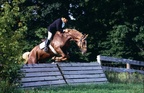 Bob taking a coop. ca 1985 -- Bob taking a coop - chasing hounds, chasing foxes in the Long Lake Hounds. ca 1985